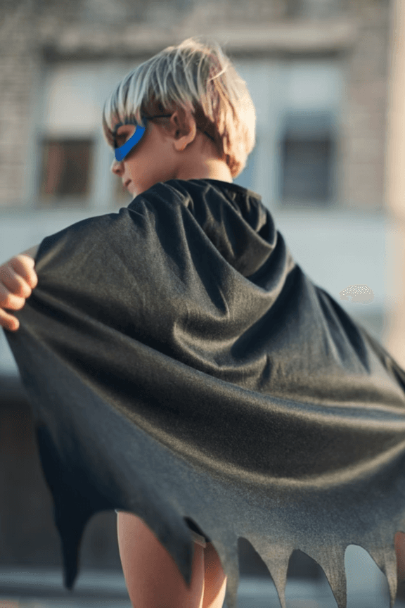 Child with superhero cape